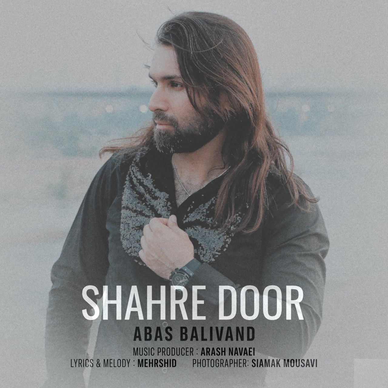 دانلود آهنگ شهر دور از عباس بلیوند